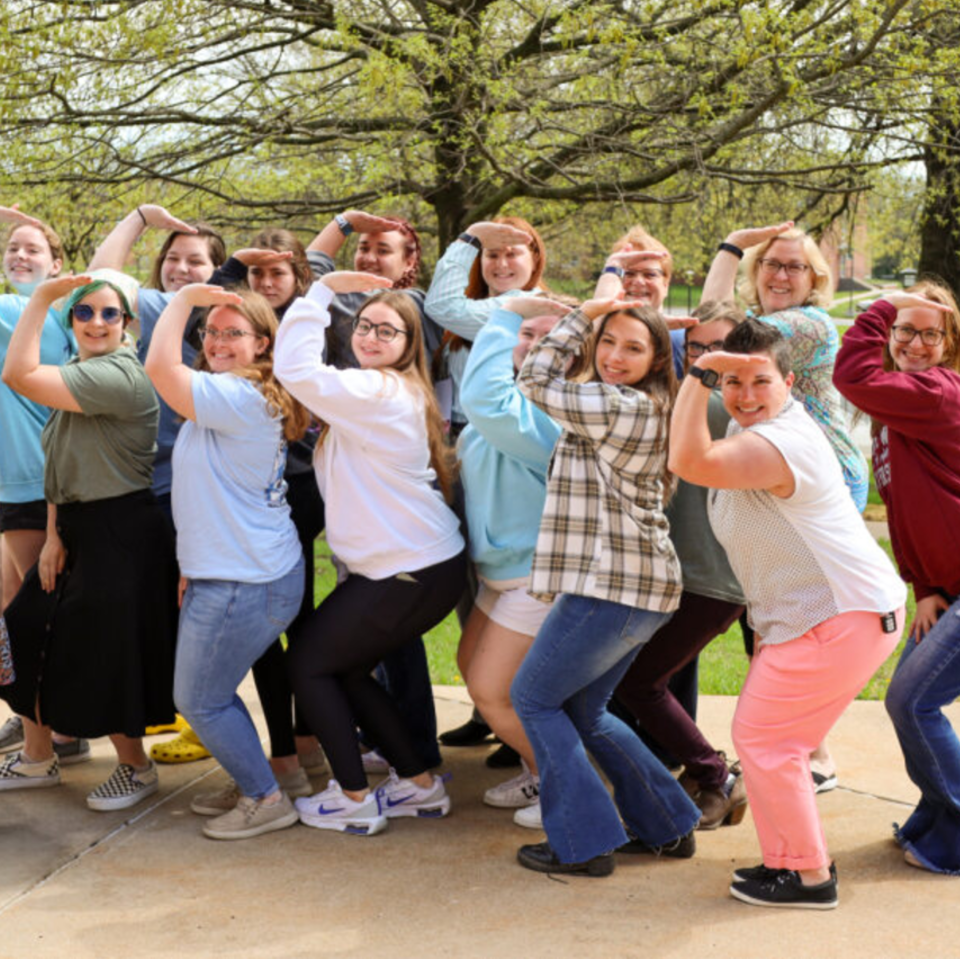 Alumni posing for a photo